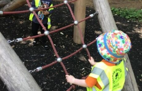 exploring and playing on a climbing frame